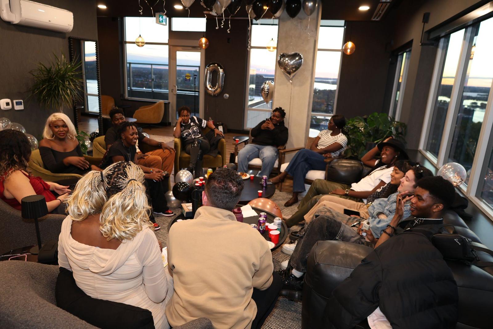 Community circle gathering with youth and volunteers.